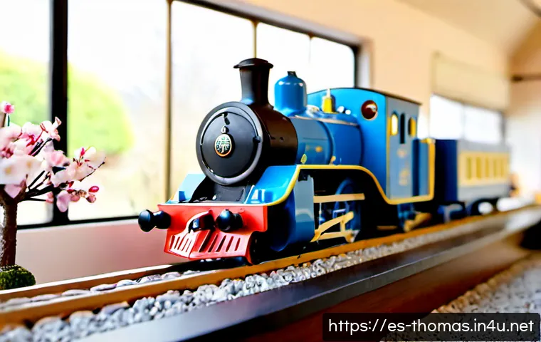토마스와 친구들 일본판 특징 - Photorealistic miniature railway display featuring a cheerful blue steam locomotive with a friendly ...